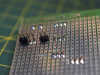 Soldering the pins and cutting the traces